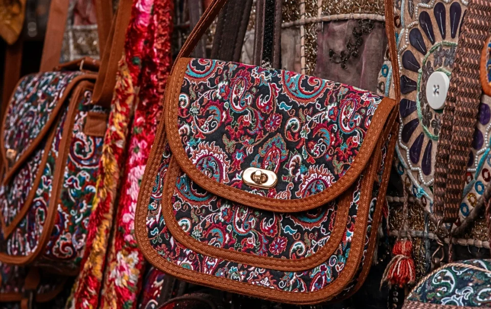 Colorful woven bags on display at Gaya Street Sunday Market in Kota Kinabalu, perfect for souvenirs