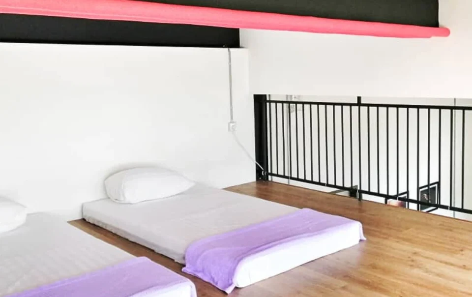 Loft area in the Super Deluxe Loft Type A apartment at Polaris Suite with two mattresses placed for additional sleeping space.