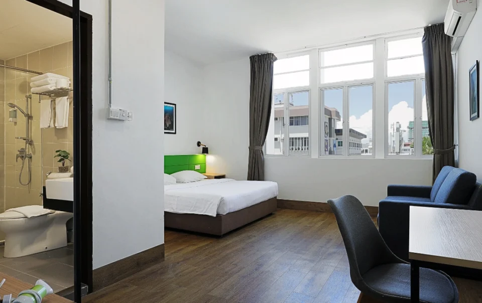 Super Deluxe Apartment with Loft Type B at Polaris Suite featuring a layout similar to Type A, with one bedroom furnished with a queen bed and a sofa bed