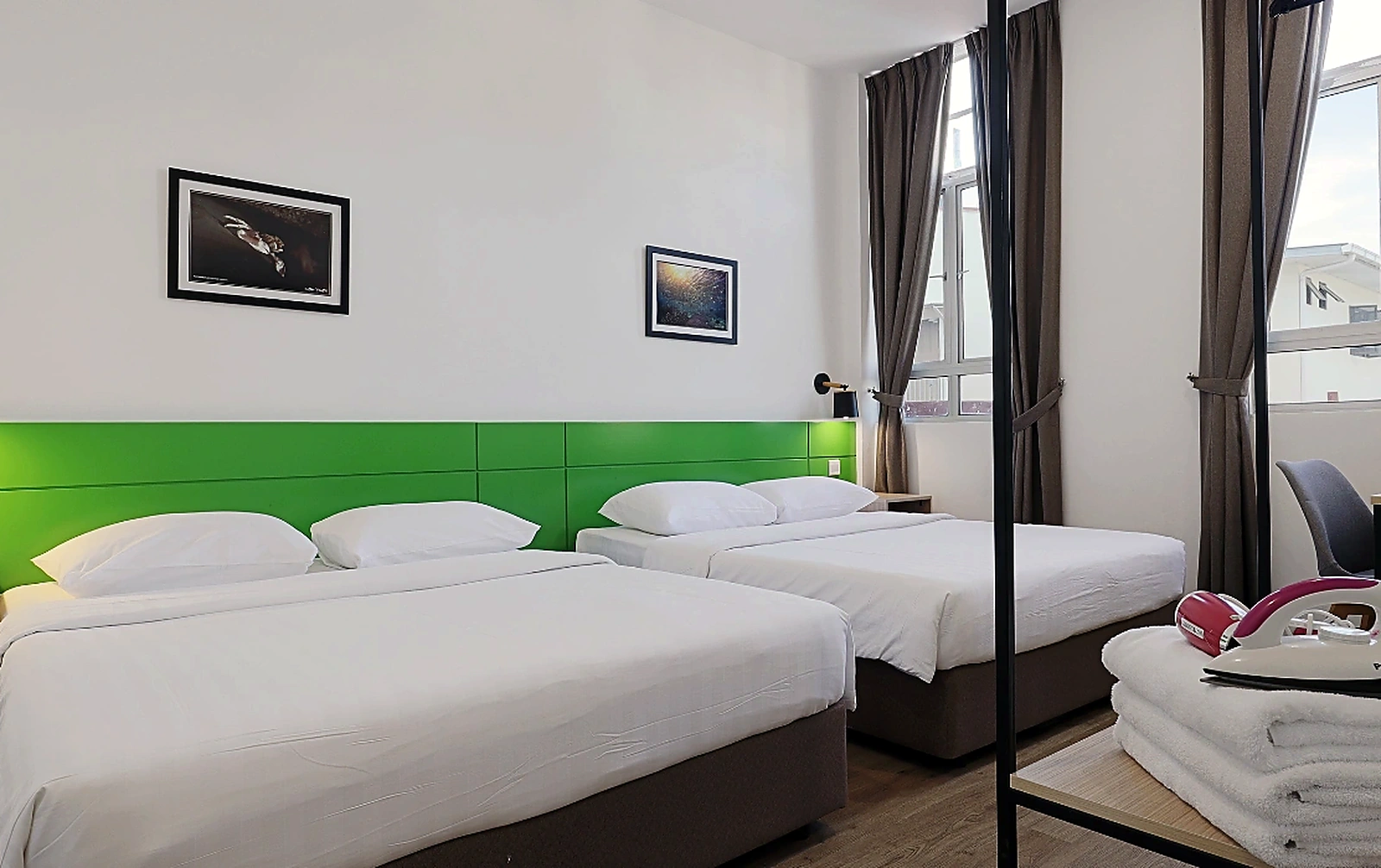 Two queen beds in private bedroom at Polaris Suite KK 2-bedroom accommodation