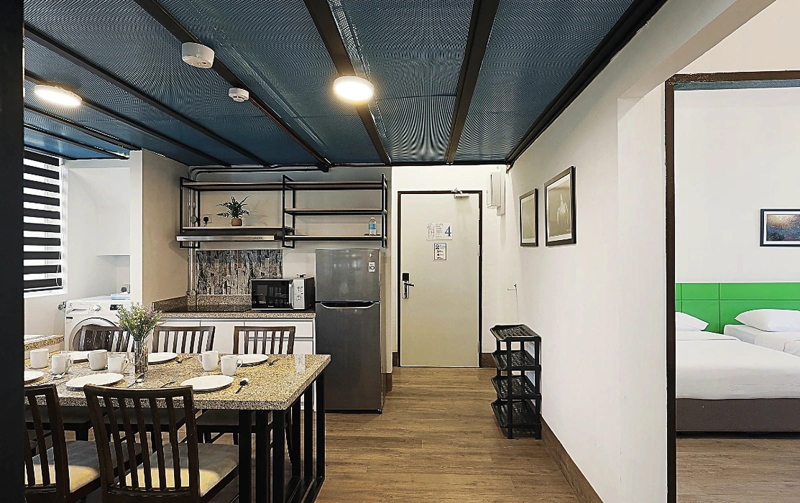 Fully equipped kitchen and in-suite washing machine in Polaris Suite KK 2-bedroom apartment